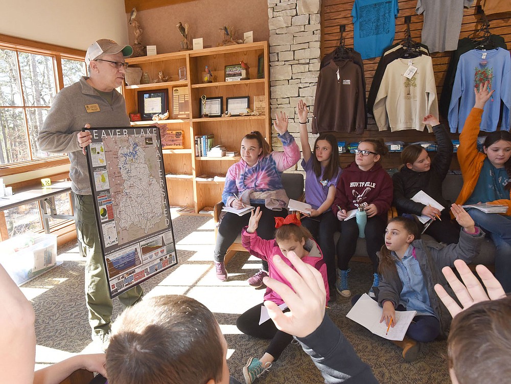 NWA Democrat-Gazette/FLIP PUTTHOFF
PRECIOUS WATER
Chris Pistole, park interpreter at Hobbs State Park-Conservation Area, teaches Tuesday March 5 2019 a lesson on surface water and ground water to students from Huntsville Intermediate School at the park's visitor center. Students studied environmental subjects and did exercises to compliment the lessons. The field trip was funded in part by the Arkansas Humanities Council, said Terri Kennedy, science facilitator for the school.