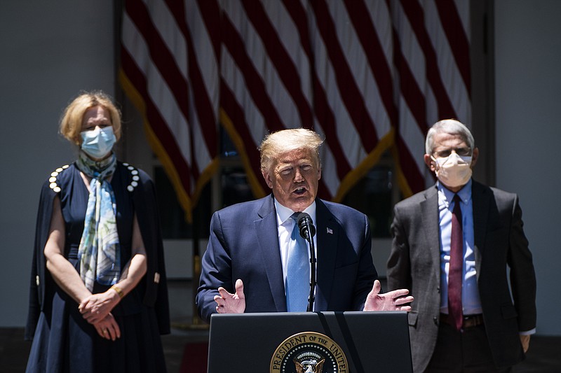 White House coronavirus response coordinator Deborah Birx, left, and National Institute of Allergy and Infectious Diseases Director Anthony S. Fauci listen as former president Donald Trump speaks in May 2020. MUST CREDIT: Washington Post photo by Jabin Botsford