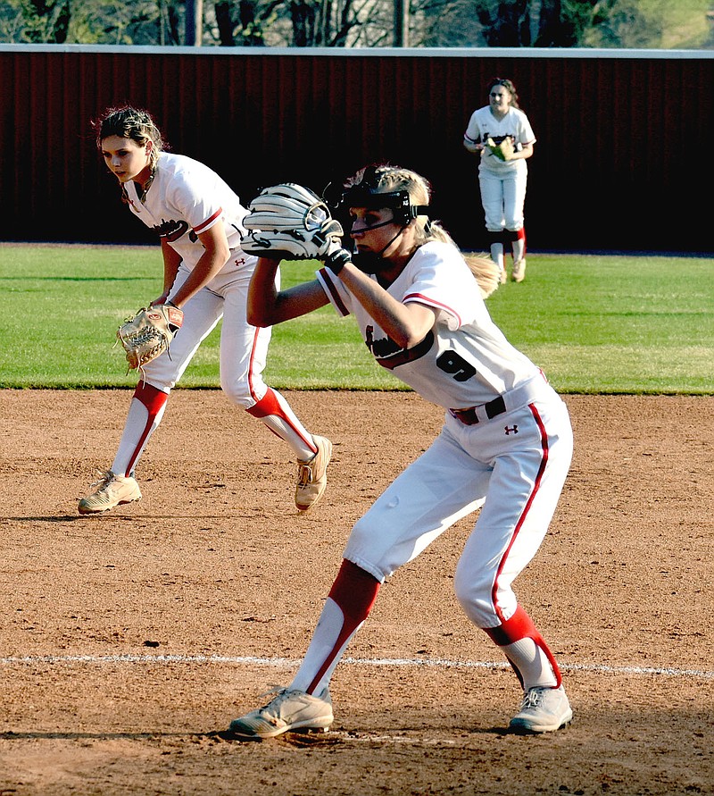 MARK HUMPHREY  ENTERPRISE-LEADER/Farmington junior Kennedy Griggs was one of four pitchers utilized by coach Randy Osnes during the Lady Cardinals' 9-7 come-from-behind win to knock off previously unbeaten Bentonville West in nonconference softball action on Monday, March 29.