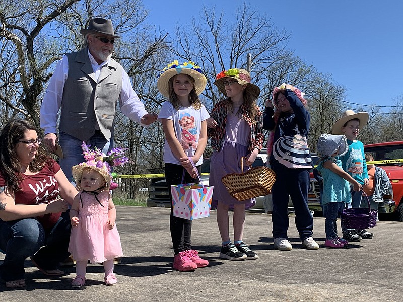 SALLY CARROLL/SPECIAL TO MCDONALD COUNTY PRESS Children show off their Easter bonnets during the children's portion of the Easter bonnet pageant. Far left, MaKenzie Blakeley was named the grand prize winner in that category Sunday afternoon.