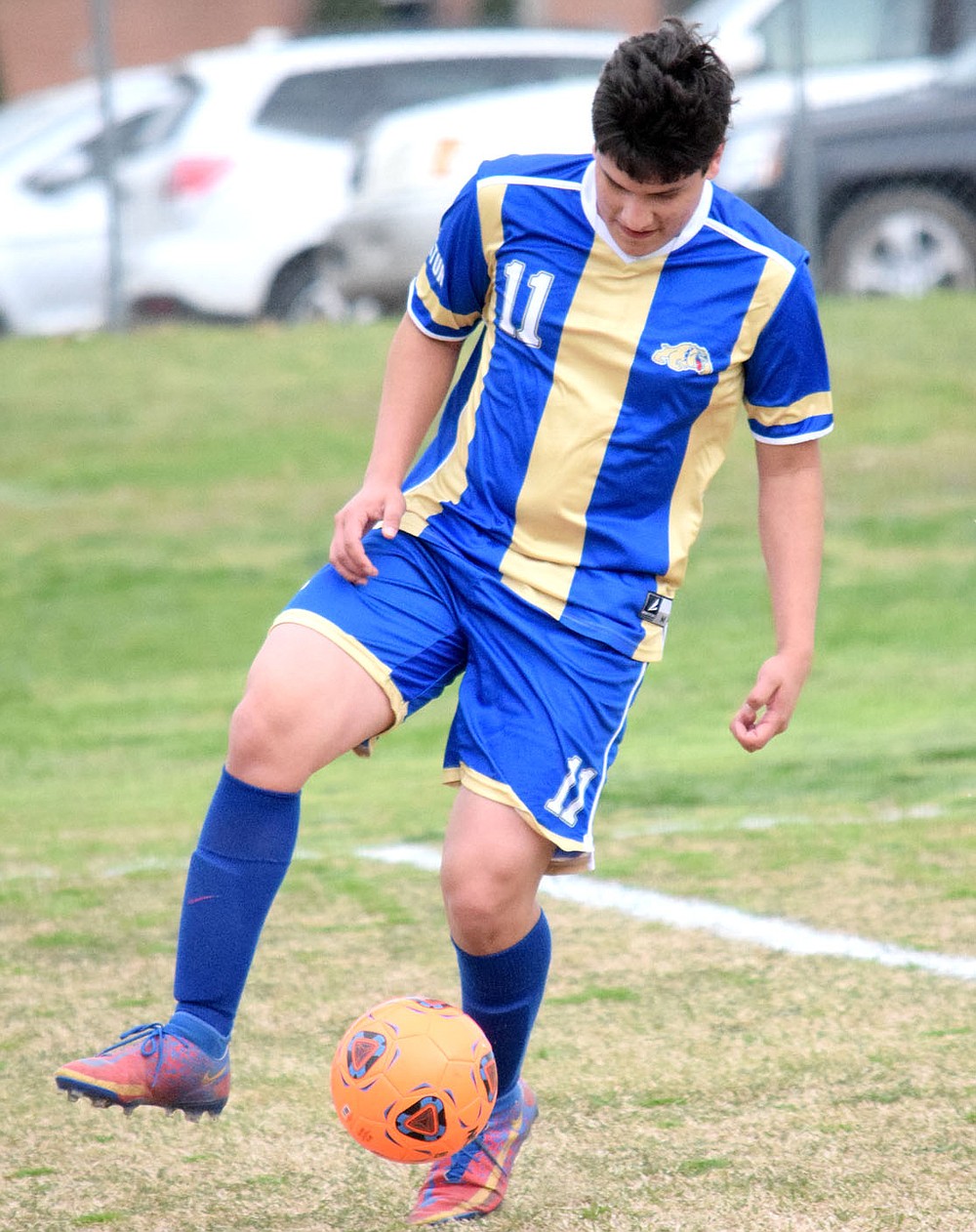 Westside Eagle Observer/MIKE ECKELS
Roger Hernandez shows his agility as he maneuvers the ball in place as he prepares to attack the Highlander net during the Decatur-Eureka Springs conference soccer match at Bulldog Stadium in Decatur March 30. Hernandez picked up three goals for the contest which contributed to the Bulldogs 6-1 win over the Highlanders.