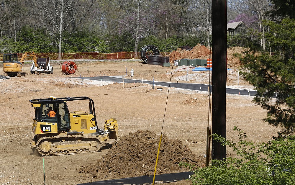 Infrastructure work continues Thursday, April 1, 2021, on the first phase of the development on Markham Hill near the intersection of Markham Road and Cross Avenue in Fayetteville. Check out nwadg.com/photos for a photo gallery.
(NWA Democrat-Gazette/David Gottschalk)