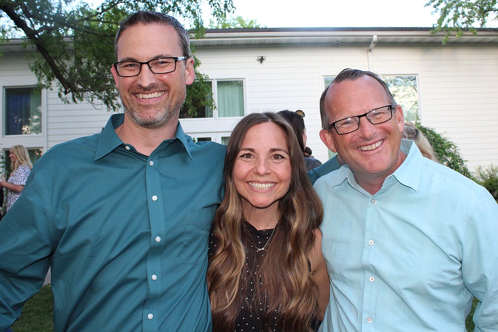 NWA Democrat-Gazette/CARIN SCHOPPMEYER Zach and Sarah Brothers (from left) and Mike Luttrell gather at the Plant a Seed Soiree on April 26 at The Ballroom on I Street in Bentonville.