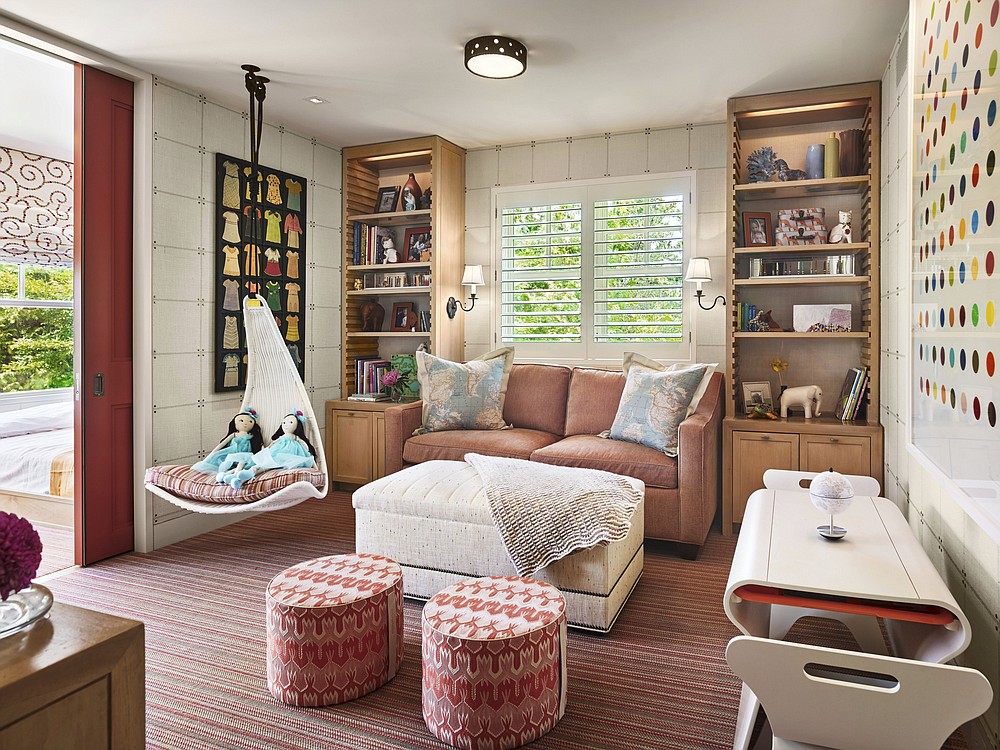 Philadelphia-based interiors firm Marguerite Rodgers added a playful, cheery red pocket door to a recent kids' room project on the Jersey Shore. (Hello PR Group/Halkin Mason Photography via AP)
