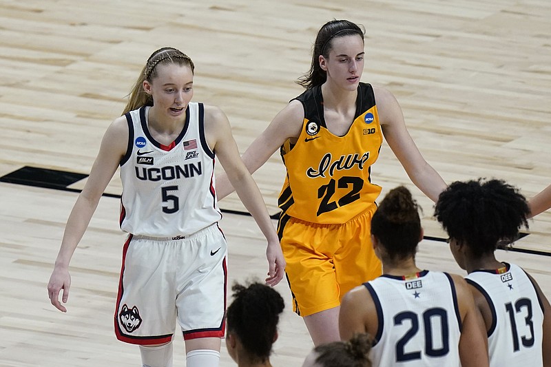 UConn guard Paige Bueckers (5) and Iowa guard Caitlin Clark (22) walk off the court after their college basketball game in the Sweet Sixteen round of the women's NCAA tournament at the Alamodome in San Antonio, Saturday, March 27, 2021. (AP Photo/Eric Gay)