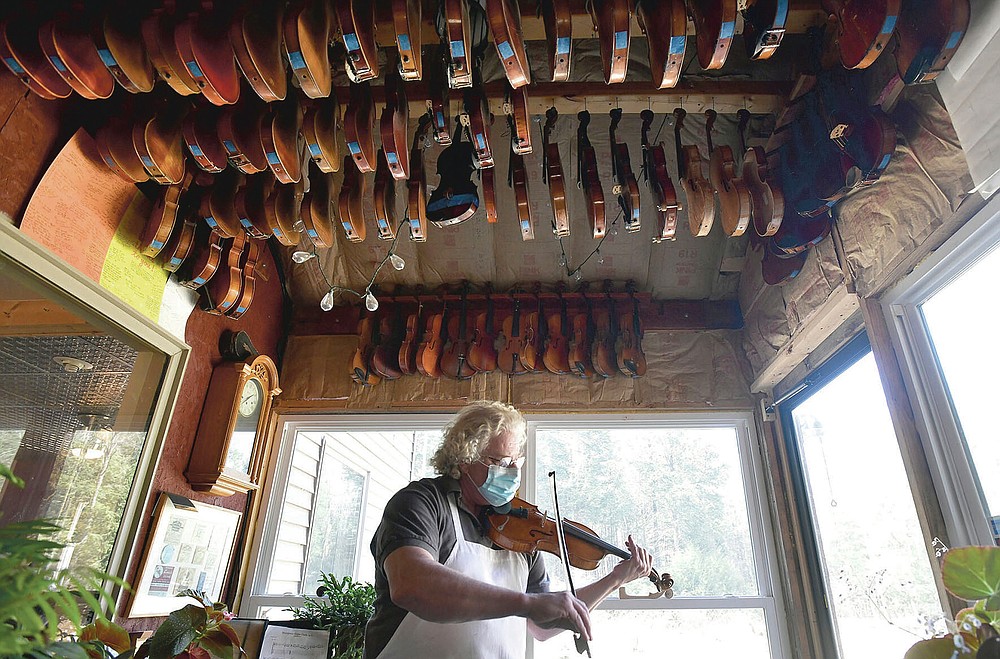 Violin-maker Robert Gordon, of Belsano, Pa, performs "Faded Love Song" on one of his violins on Monday, March 22, 2021. (Todd Berkey/The Tribune-Democrat via AP)