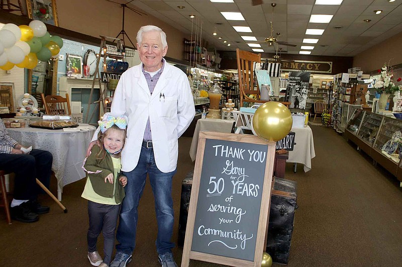 LYNN KUTTER ENTERPRISE-LEADER
Sterling Drug in Prairie Grove held a reception April 1 in honor of Gary Davis to celebrate his 50th year as pharmacist for the local store. His youngest granddaughter, Raelynn Chandler, 4, of Tulsa, was in town to celebrate with her granddad.