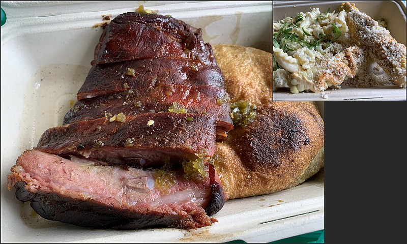 The 1/3 slab of St. Louis-style ribs (above) and the Navajo fry bread come in one container as part of Low Ivy's Pepper Jelly Rib Platter. In the other container (top right): jalapeno pasta salad and elote corn "ribs." (Arkansas Democrat-Gazette/Eric E. Harrison)