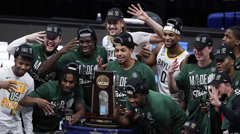 Baylor players celebrate after an Elite 8 game against Arkansas in the NCAA men's college basketball tournament at Lucas Oil Stadium, Tuesday, March 30, 2021, in Indianapolis. Baylor won 81-72. (AP Photo/Darron Cummings)