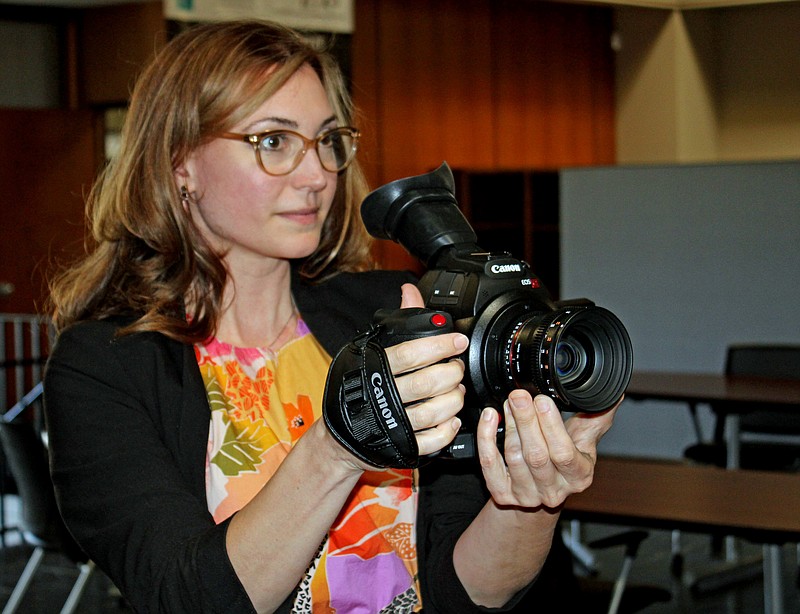 Jen Gerber, instructor for Low Key Art’s Inception to Projection program and executive director of the Hot Springs Documentary Film Festival, shows off the Canon C100 that Inception students will learn how to make films on in class. - Photo by Tanner Newton of The Sentinel-Record