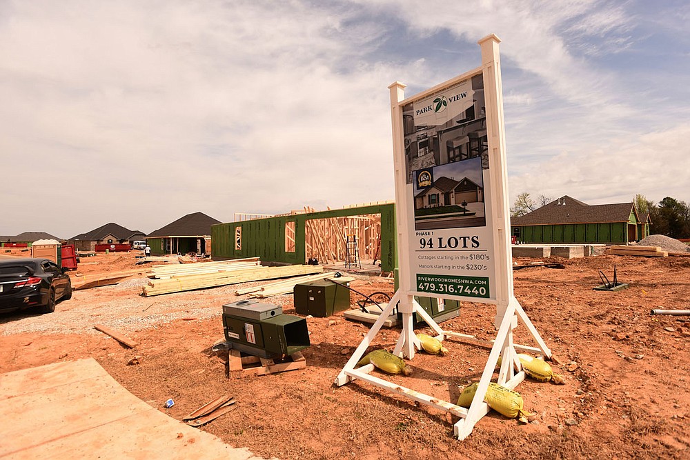 Dozens of homes are under construction at Park View subdivision in Lowell, seen March 30 2021, being built by Riverwood Homes. (NWA Democrat-Gazette/Flip Putthoff)