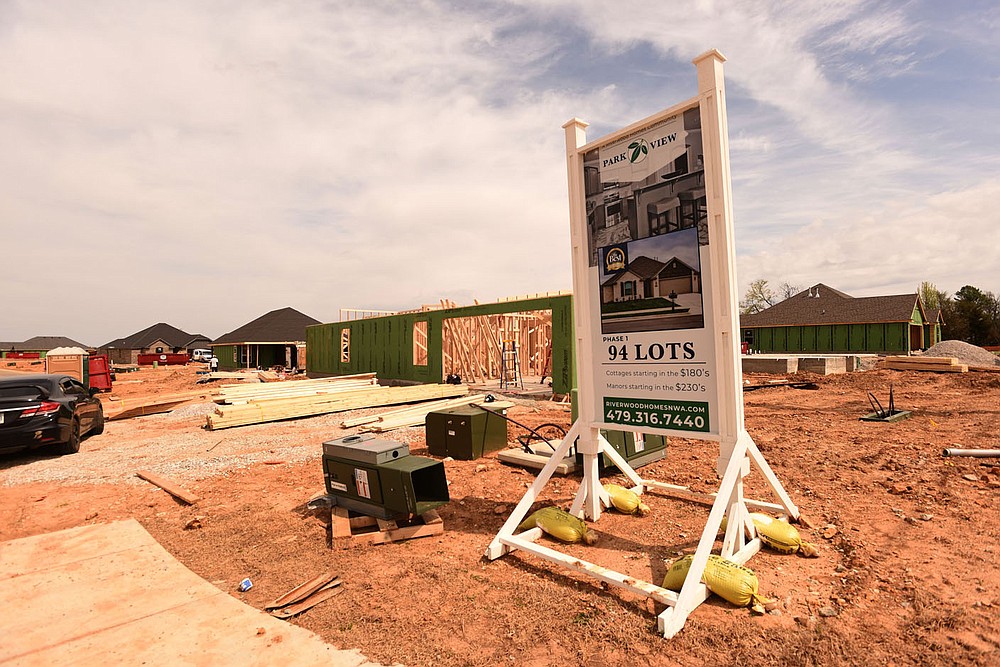 Dozens of homes are under construction at Park View subdivision in Lowell, seen March 30 2021, being built by Riverwood Homes.
(NWA Democrat-Gazette/Flip Putthoff)