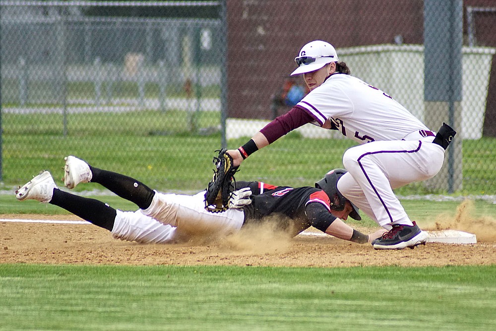 Westside Eagle Observer/RANDY MOLL
Gentry first baseman Garry Cox puts the tag on a Pea Ridge base runner in a pickoff attempt on March 30 at Gentry High School.