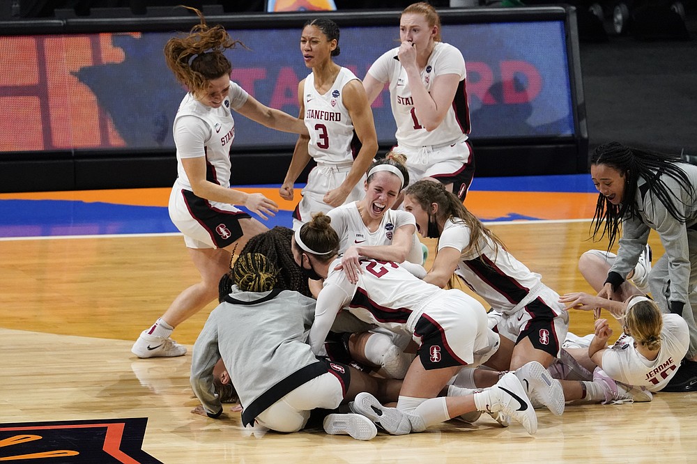 Stanford players celebrate at the end of the championship game against Arizona in the women's Final Four NCAA college basketball tournament, Sunday, April 4, 2021, at the Alamodome in San Antonio. Stanford won 54-53. (AP Photo/Eric Gay)