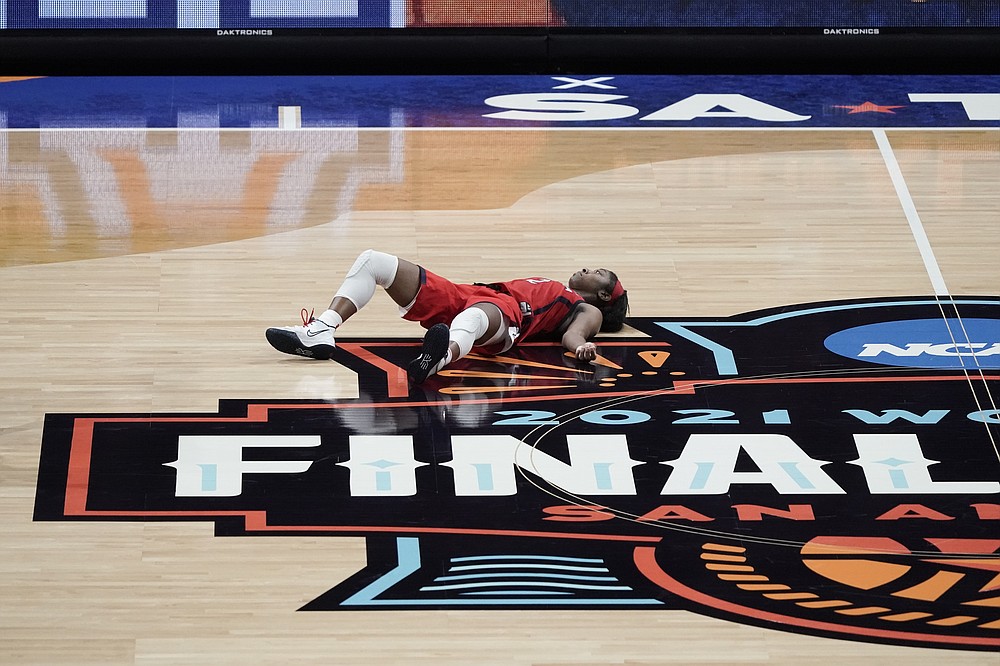 Arizona guard Aari McDonald lies on the court after missing a shot at the end of the championship game against Stanford in the women's Final Four NCAA college basketball tournament, Sunday, April 4, 2021, at the Alamodome in San Antonio. Stanford won 54-53. (AP Photo/Morry Gash)