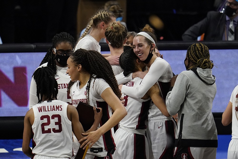 Stanford players celebrate at the end of the championship game against Arizona in the women's Final Four NCAA college basketball tournament, Sunday, April 4, 2021, at the Alamodome in San Antonio. Stanford won 54-53. (AP Photo/Eric Gay)