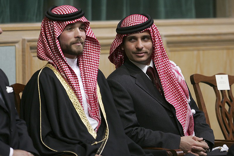 File - In this Tuesday, Nov. 28, 2006 file photo, Prince Hamza Bin Al-Hussein, right, and Prince Hashem Bin Al-Hussein, left, brothers King Abdullah II of Jordan, attend the opening of the parliament in Amman, Jordan. Prince Hamza, the half-brother of Jordan's King Abdullah II, said he has been placed under house arrest. in a videotaped statement late Saturday, April 3. - AP Photo/Mohammad abu Ghosh