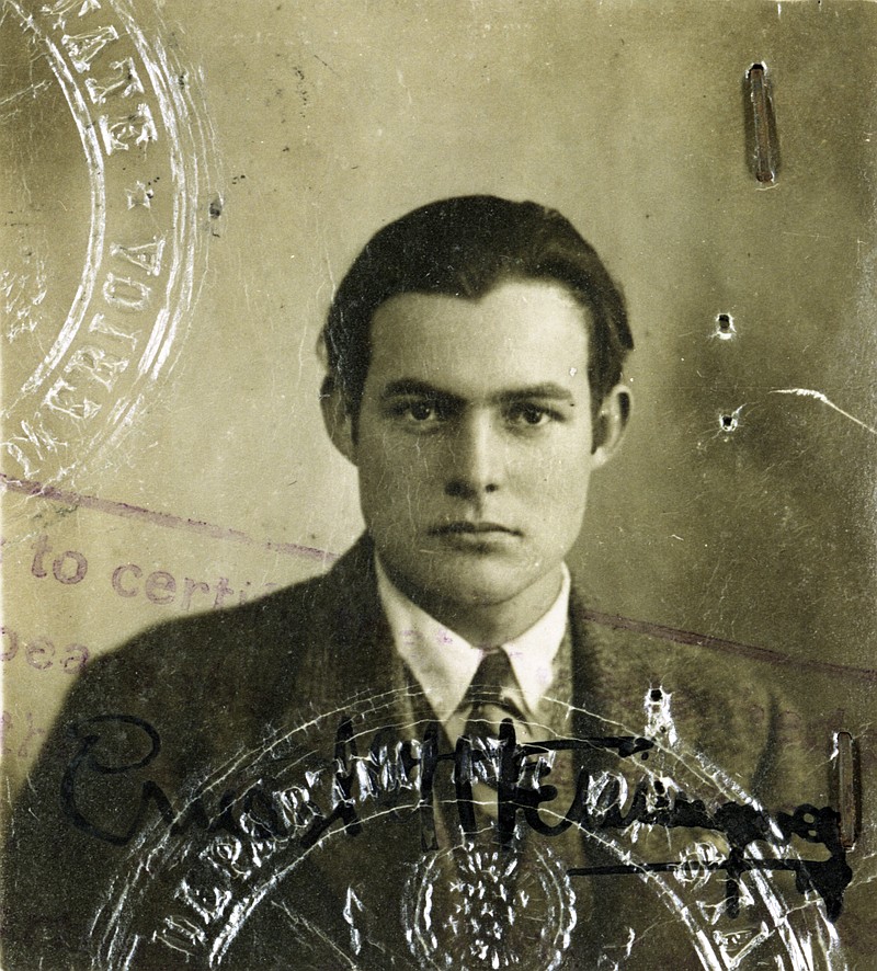 This 1920s photo provided by the John F. Kennedy Library Foundation from the Ernest Hemingway Collection shows Ernest Hemingway in his U.S. passport photo. A new three-part documentary about Hemingway, which relied heavily on the archives at the John F. Kennedy Presidential Library and Museum in Boston, debuts April 5, 2021, on PBS. (John F. Kennedy Presidential Library and Museum, Boston via AP)