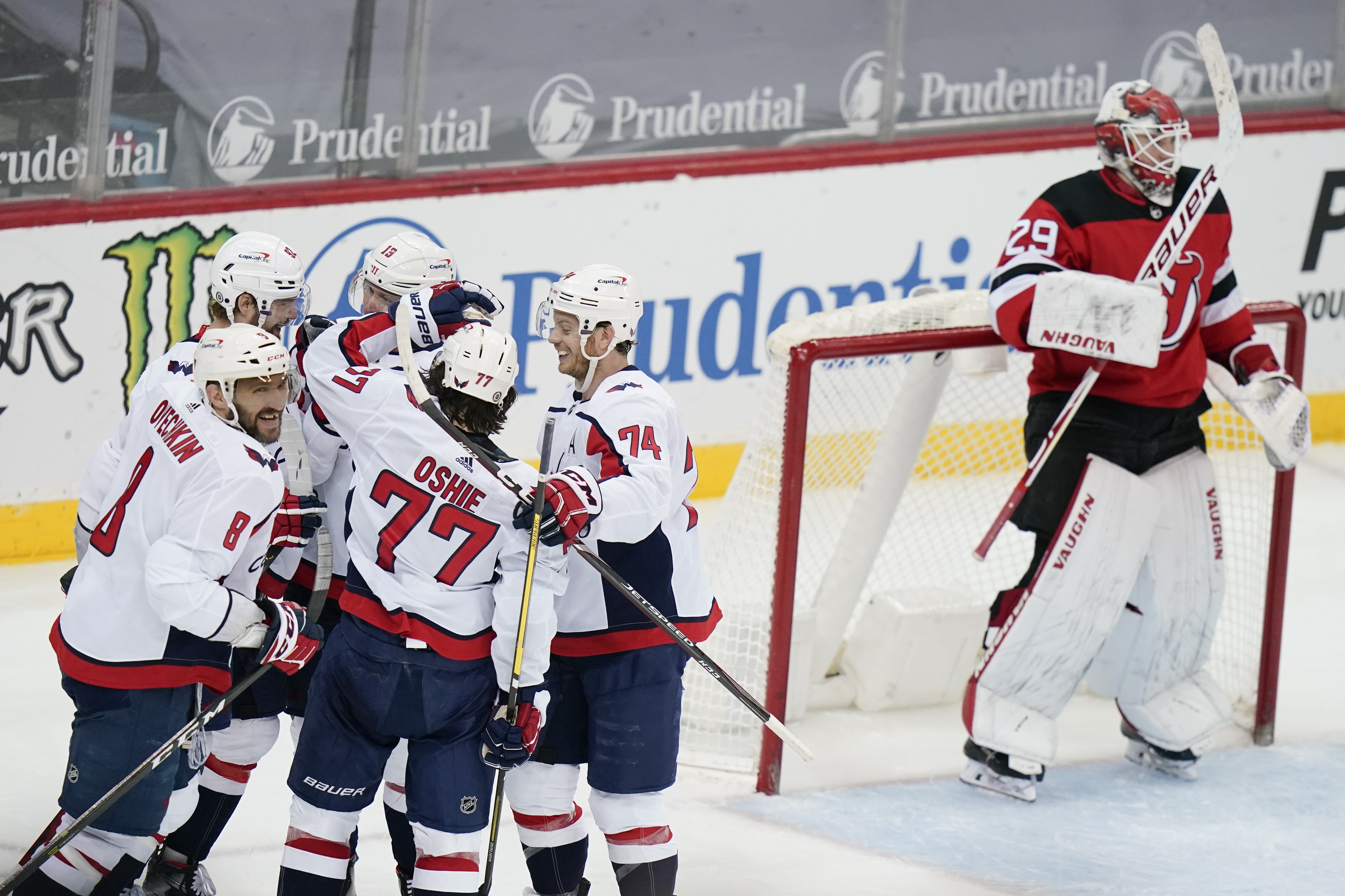 T.J. Oshie scores twice, Capitals come back to beat Devils