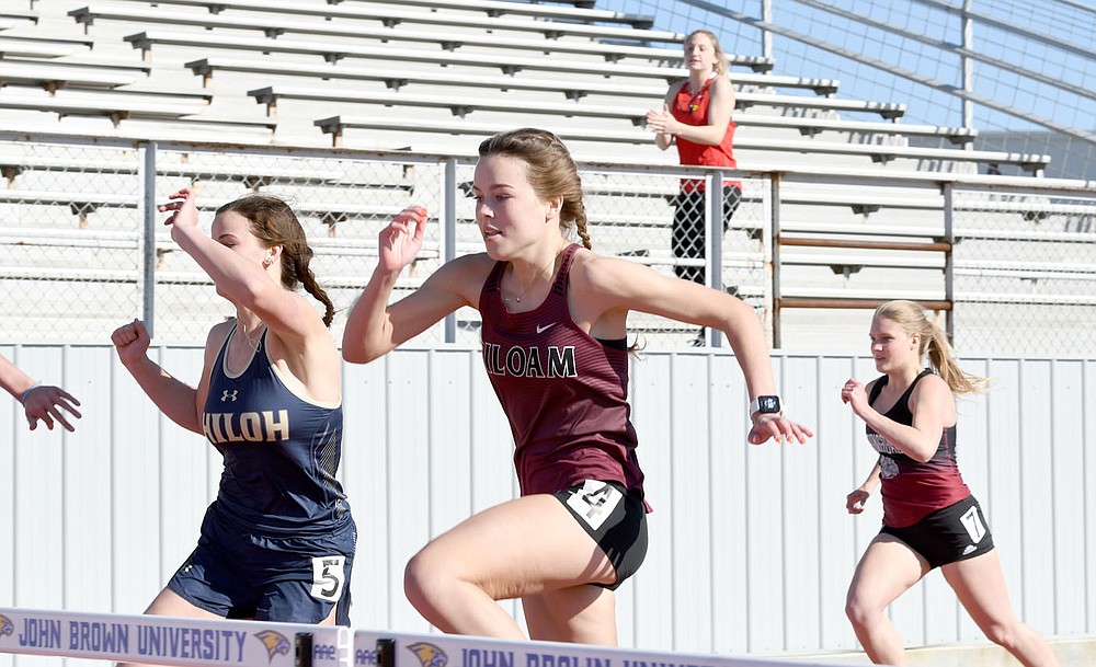 Bud Sullins/Special to the Herald-Leader
Siloam Springs senior Quincy Efurd runs the hurdles during the Panther Relays on April 1 at Glenn W. Black Stadium.