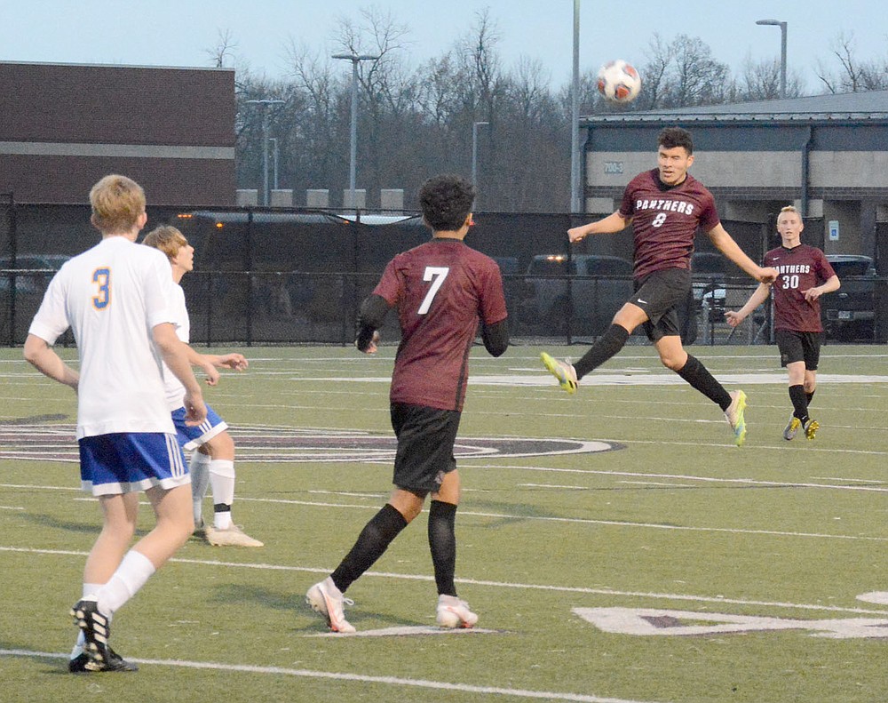 Graham Thomas/Herald-Leader
Siloam Springs junior Jason Flores goes up to head a ball against Mountain Home on March 12.