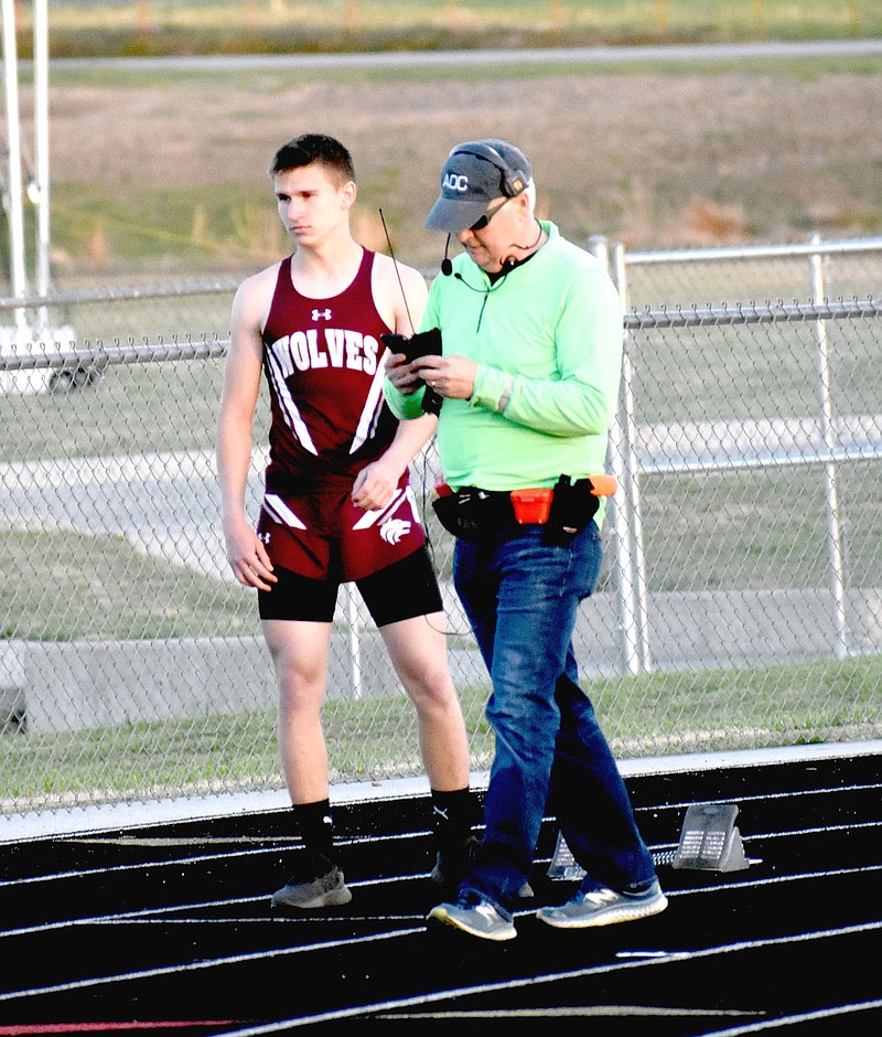 MARK HUMPHREY  ENTERPRISE-LEADER/Lincoln sophomore Layne Sellers (left), shown preparing for a running event, won the boys pole vault competition by clearing 9 feet during the Wolf Relays hosted by Lincoln Thursday. Sellers also placed 18th in the 200 meters with a time of 28.64.