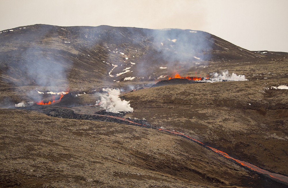 Hikers scramble as new fissure opens up at Icelandic volcano