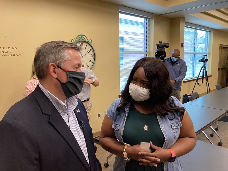Congressman Bruce Westerman (left) visits Monday morning with Melrita Johnson, one of the "hometown heroes" being recognized for performing selfless acts during the pandemic. (Pine Bluff Commercial/Byron Tate)