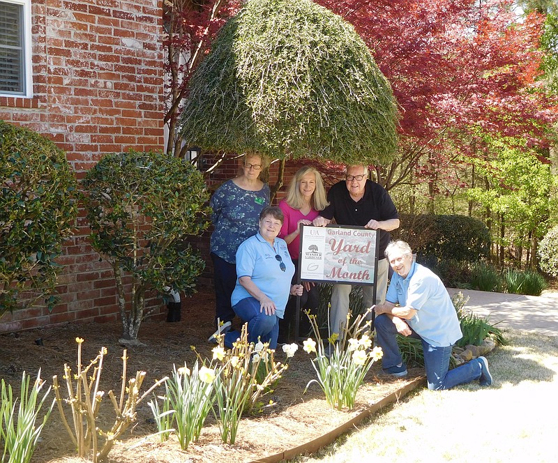 In front are Master Gardeners Gaye Harper, left, and Linda Doherty, and back, from left, are Master Gardener Cindy Bright and homeowners Martha and Joe Dooley. Not pictured is Master Gardener Carolyn Davis. - Submitted photo