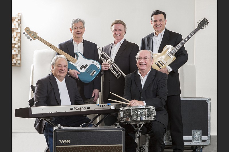 The Remnants of Rock members are Tommy France (keyboards, seated left), Johnny Bradley (drums/vocals, seated right); Mark Calhoun (bass guitar/vocals, standing left); Mike Mitchell (vocals/trumpet); and Rick Calhoun (vocals/guitar). (Special to the Democrat-Gazette/Sara Reeves)