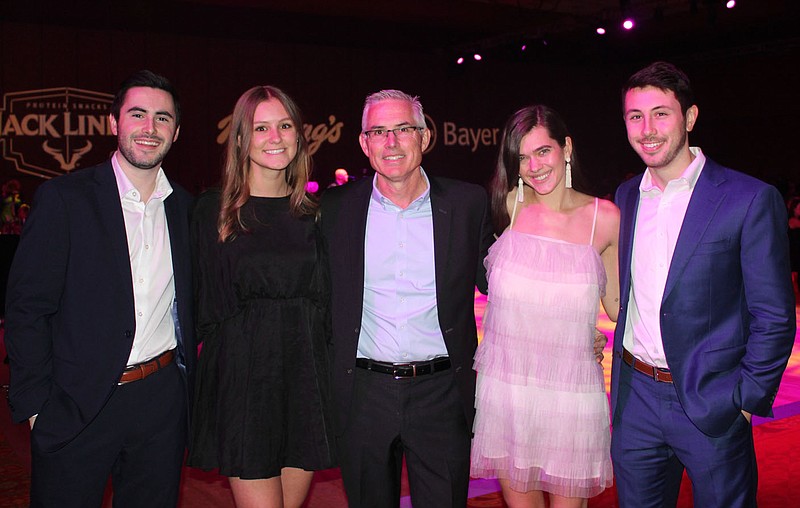 Tom McDonald, Heart Ball co-chairman (center), is joined by his family Mitch McDonald (from left), Sarah Newton and Maggie and Justin McDonald at the American Heart Association fundraiser Feb. 21 at the John Q. Hammons Center in Rogers. 
(NWA Democrat-Gazette/Carin Schoppmeyer)