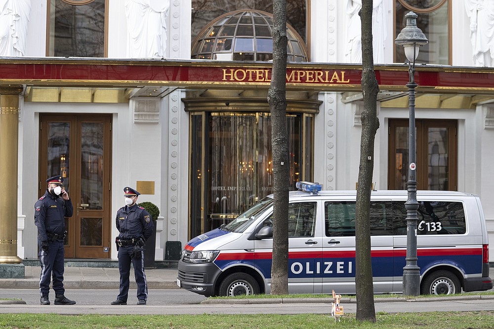 Police officers stand in front of Hotel Imperial where a delegation from Iran is staying in Vienna, Austria, Tuesday, April 6, 2021. Foreign ministry officials from the countries still in the accord, the so-called Joint Comprehensive Plan of Action, are meeting in Vienna to push forward efforts to bring the United States back into the 2015 deal on Iran’s nuclear program. (AP Photo/Florian Schroetter)