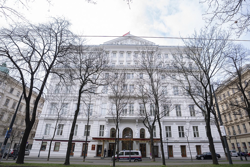 Police officers stand in front of Hotel Imperial where a delegation from Iran is staying in Vienna, Austria, Tuesday, April 6, 2021. Foreign ministry officials from the countries still in the accord, the so-called Joint Comprehensive Plan of Action, are meeting in Vienna to push forward efforts to bring the United States back into the 2015 deal on Iran’s nuclear program. (AP Photo/Florian Schroetter)