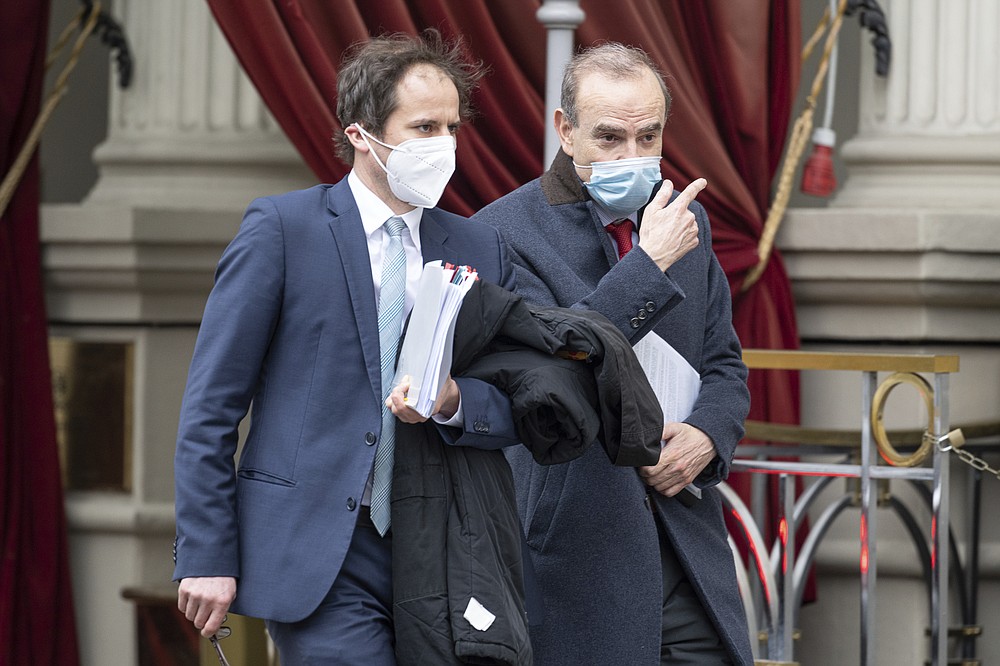 Deputy Secretary General and Political Director of the European External Action Service (EEAS), Enrique Mora, right, leaves the Grand Hotel Wien where closed-door nuclear talks with Iran take place in Vienna, Austria, Tuesday, April 6, 2021. Foreign ministry officials from the countries still in the accord, the so-called Joint Comprehensive Plan of Action, are meeting in Vienna to push forward efforts to bring the United States back into the 2015 deal on Iran's nuclear program. (AP Photo/Florian Schroetter)