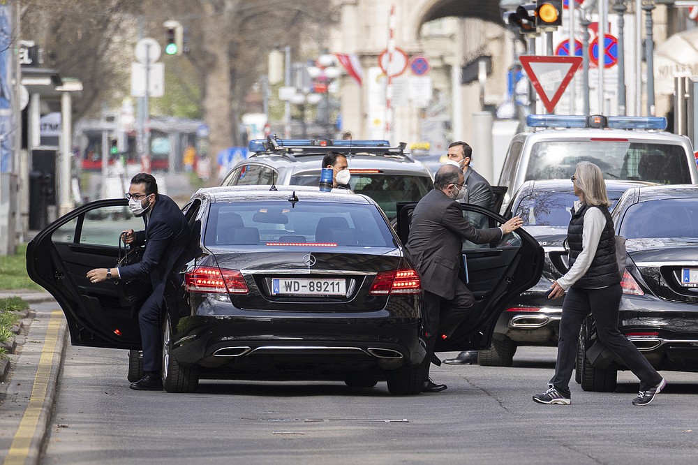 Members of a delegation leave their cars as they arrive in front of the Grand Hotel Wien in Vienna, Austria, Tuesday, April 6, 2021. Foreign ministry officials from the countries still in the accord, the so-called Joint Comprehensive Plan of Action, are meeting in Vienna to push forward efforts to bring the United States back into the 2015 deal on Iran’s nuclear program. (AP Photo/Florian Schroetter)