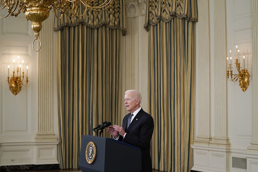 President Joe Biden delivers remarks about vaccinations, in the State Dining Room of the White House, Tuesday, April 6, 2021, in Washington. (AP Photo/Evan Vucci)
