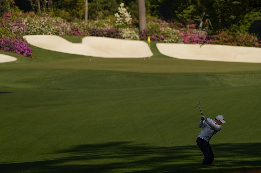 Rory McIlroy, of Northern Ireland, hits from the fairway on the 13th hole during a practice round for the Masters golf tournament on Tuesday, April 6, 2021, in Augusta, Ga. (AP Photo/David J. Phillip)