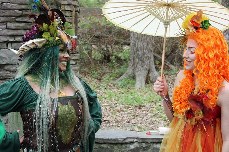 Victoria Heather, as Nadijh, left, and Emilie Boyett, as Pyra, speak at Hollywood Park on Tuesday. - Photo by Tanner Newton of The Sentinel-Record