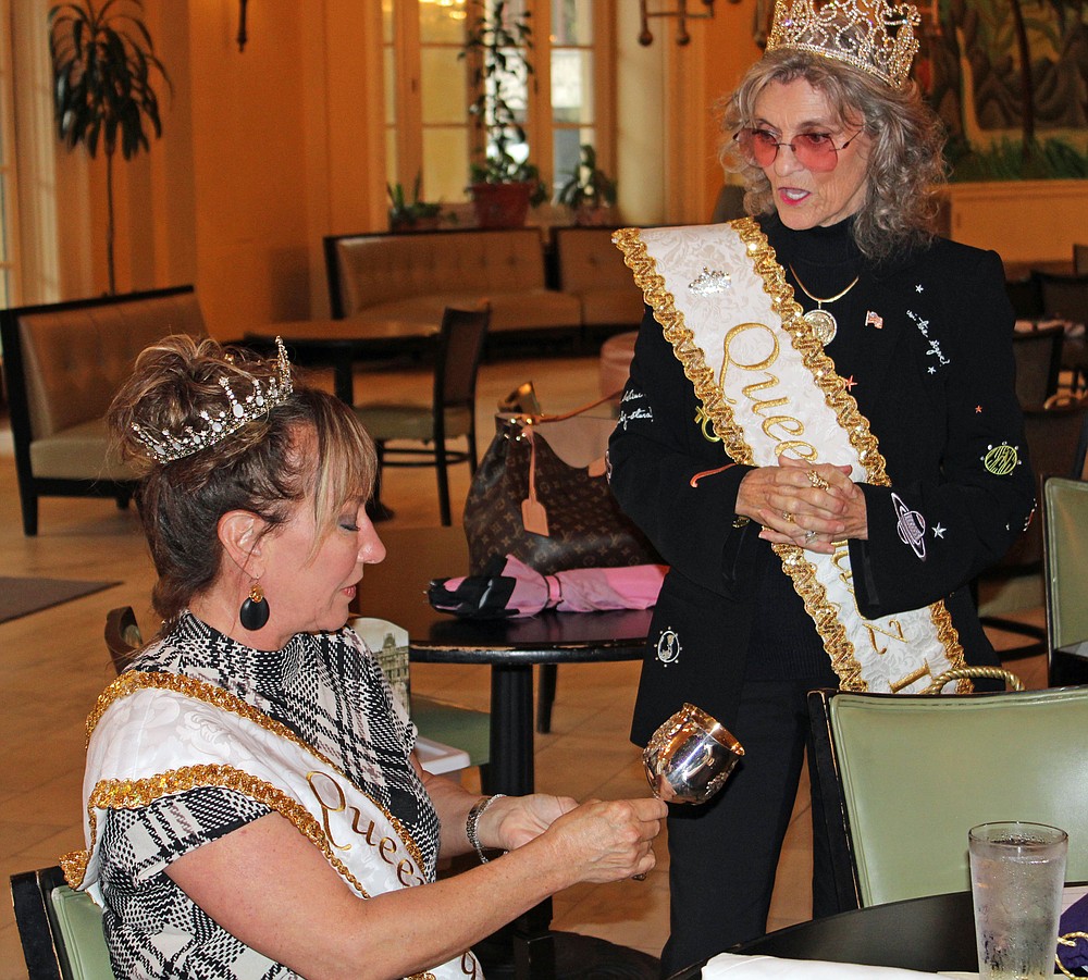 er Royal Highness Beth Gipe Queen Jazz IX, left, is presented with her engraved goblet Wednesday during the annual luncheon of the Hot Spring Jazz Society Royalty by H.R.H. Sharon Turrentine QJII in the lobby of the Arlington Resort Hotel & Spa. - Photo by Tanner Newton of The Sentinel-Record