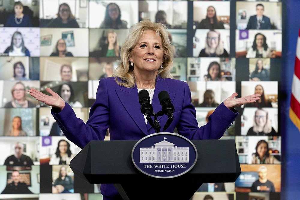 First lady Jill Biden speaks at a virtual event with military families from around the world as part of the White House initiative to support military and veteran families in the South Court Auditorium in the Eisenhower Executive Office Building on the White House Campus, Wednesday, April 7, 2021, in Washington. (AP Photo/Andrew Harnik)