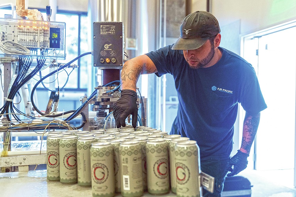 A worker from Mobile West Canning cans Luiseño Hazy IPA on June 30, 2020, at the Rincon Reservation Road Brewery in Valley Center, Calif. As Southern California's first craft brewery on tribal lands, the 3R Brewery, as it's known, aims to educate beer lovers about the Rincon Band of Luiseño Indians and inspire young tribal members with a passion for hops. (Harrah's Resort Southern California/Indian Country Today via AP)