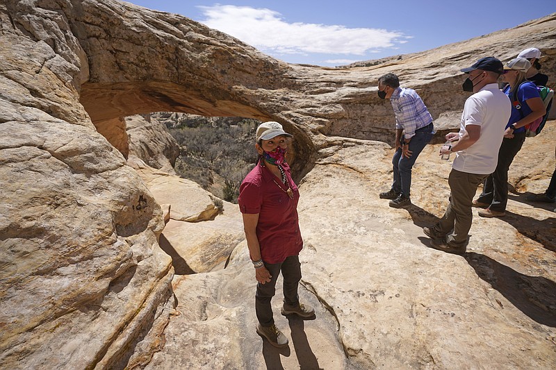 U.S. Interior Secretary Deb Haaland tours near ancient dwellings along the Butler Wash trail during a visit to Bears Ears National Monument Thursday, April 8, 2021, near Blanding, Utah. (AP Photo/Rick Bowmer, Pool)