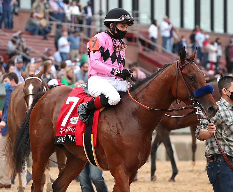 Jockey Joel Rosario and Concert Tour are led into the winner’s circle after the Rebel Stakes at Oaklawn Racing Casino Resort on March 13. Concert Tour is the expected favorite for the Arkansas Derby scheduled for Saturday. - Photo by Richard Rasmussen of The Sentinel-Record
