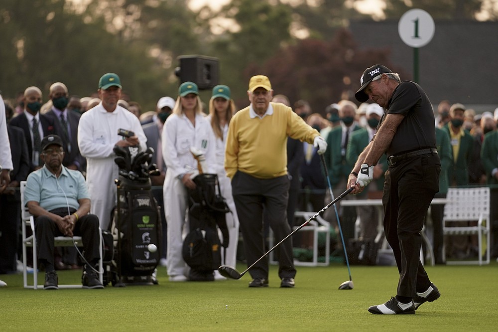 Lee Elder and Jack Nicklaus watch as Gary Player hits the ceremonial first tee during the first round of the Masters golf tournament on Thursday, April 8, 2021, in Augusta, Ga. (AP Photo/Matt Slocum)