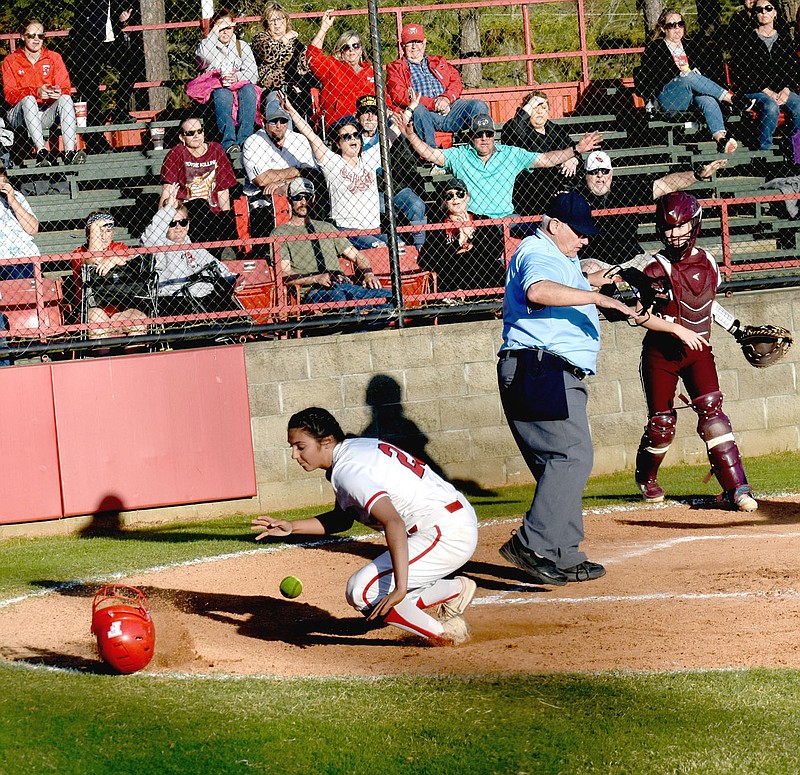 MARK HUMPHREY  ENTERPRISE-LEADER/Farmington sophomore Skyler Riddle scores a key run on a passed ball to cap a fifth inning rally by the Lady Cardinals, who came back to beat Gentry, 7-6, on Thursday.