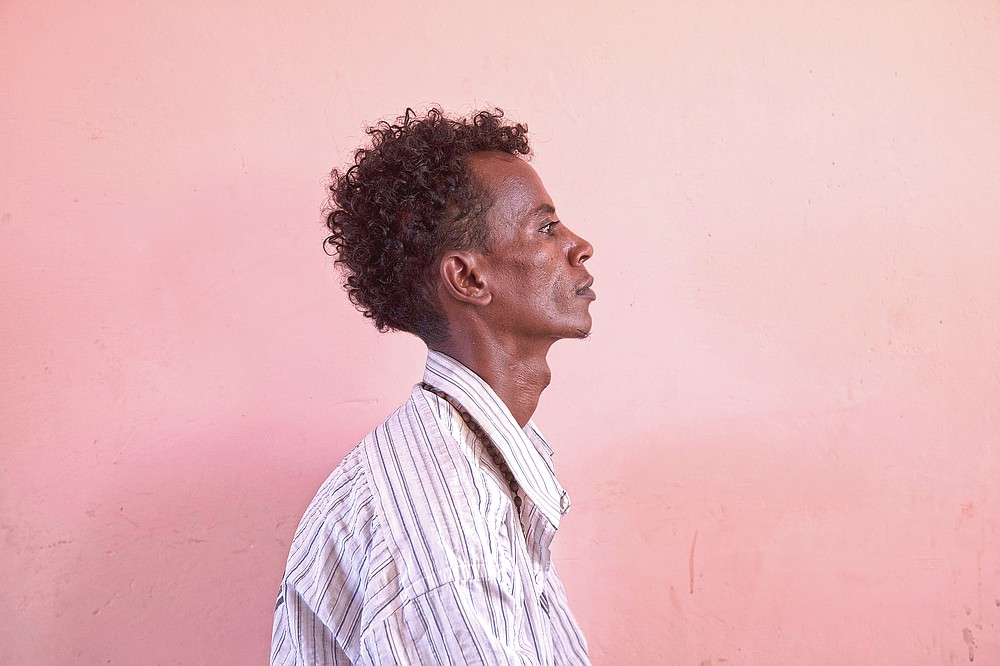 Tigrayan refugee Goitom Hagos, a 26-year-old nurse from Humera who fled the conflict in Ethiopia's Tigray, is photographed in eastern Sudan near the Sudan-Ethiopia border, on March 18, 2021. "I saw many Tigrayans collected and loaded into vehicles. I saw thousands," said Hagos, who was detained by police for several days with some 300 people, including children. (AP Photo/Nariman El-Mofty)