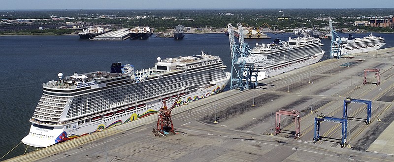 FILE - In this May 4, 2020 file photo, Norwegian cruise ships are docked at Portsmouth Marine Terminal in Portsmouth, Va. Norwegian Cruise Line is announcing plans to resume sailing after being shut down for more than a year by the pandemic. Norwegian said Tuesday, May 4, 2020,  that it plans trips in late July in the Greek islands and in August in the Caribbean.  (Stephen M. Katz/The Virginian-Pilot via AP, File)