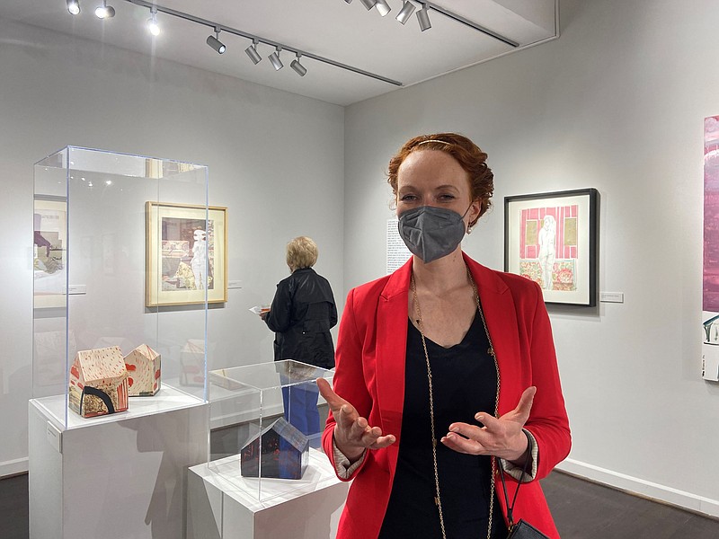 Yelena Petroukhina talks about the pieces at the opening reception of her exhibit, 'Defining Home: Mixed Media & Ceramics of Yelena Petroukhina' at the Arts and Science Center for Southeast Arkansas earlier this month. (Special to The Commercial/Deborah Horn)