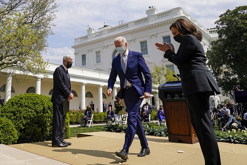 President Joe Biden, accompanied by Vice President Kamala Harris, right, and Attorney General Merrick Garland, left, departs after speaking about gun violence prevention in the Rose Garden at the White House, Thursday, in Washington. - AP Photo/Andrew Harnik