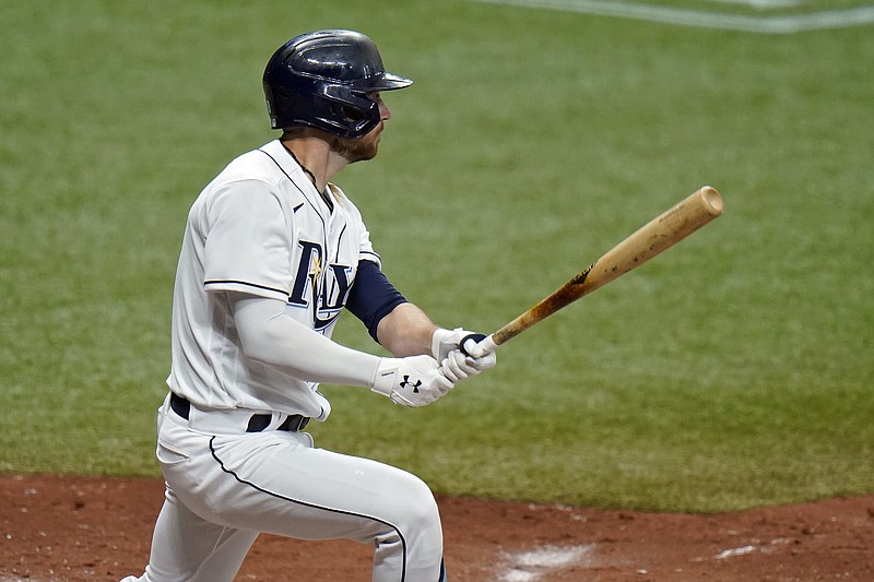 Tampa Bay Rays' Brandon Lowe lines a three-run triple off New York Yankees relief pitcher Nick Nelson during the fourth inning of a baseball game Friday, April 9, 2021, in St. Petersburg, Fla. (AP Photo/Chris O'Meara)